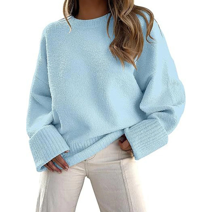 Light blue fuzzy knit pullover sweater with crew neck and ribbed cuffs, oversized fit