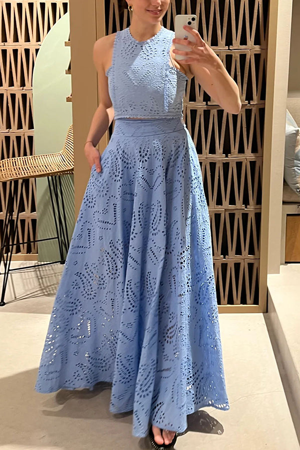 Blue embroidered sleeveless crop top and high-waist maxi skirt set, standing front view