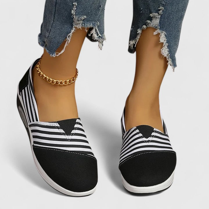 Anika orthopedic slip-on sneakers, black upper with white striped sides and white traction sole