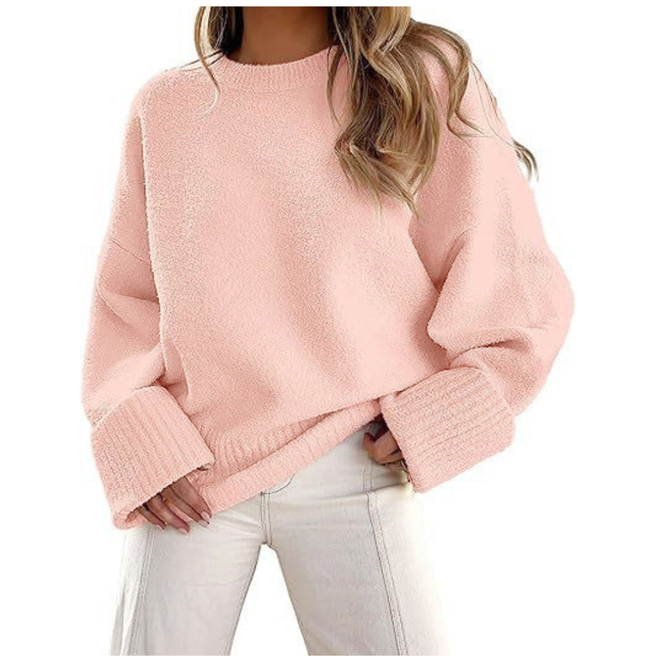 Pink fuzzy knit pullover sweater with crew neck and ribbed cuffs, oversized fit