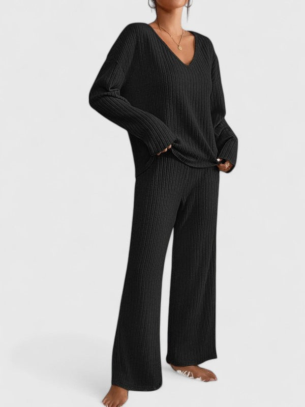 Black ribbed v-neck sweater and wide-leg pants set with wide pant legs.