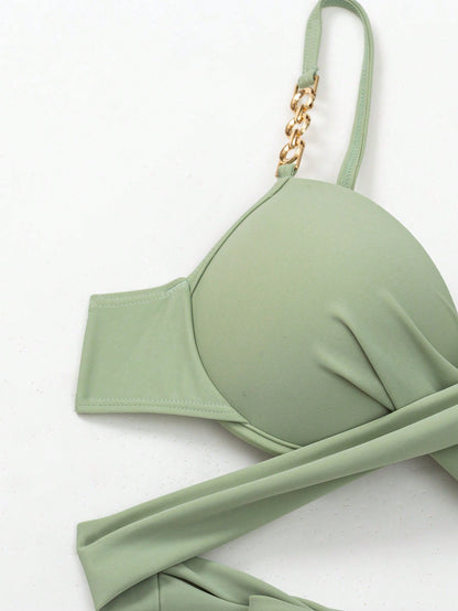 Green bikini top with thin straps and gold ring detail