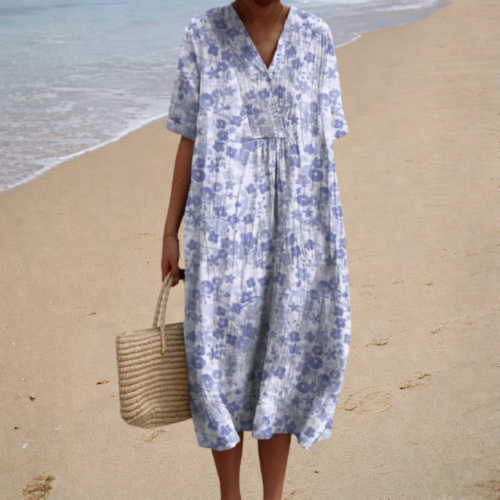 Floral summer dress with V-neck and short sleeves, light blue pattern, relaxed fit