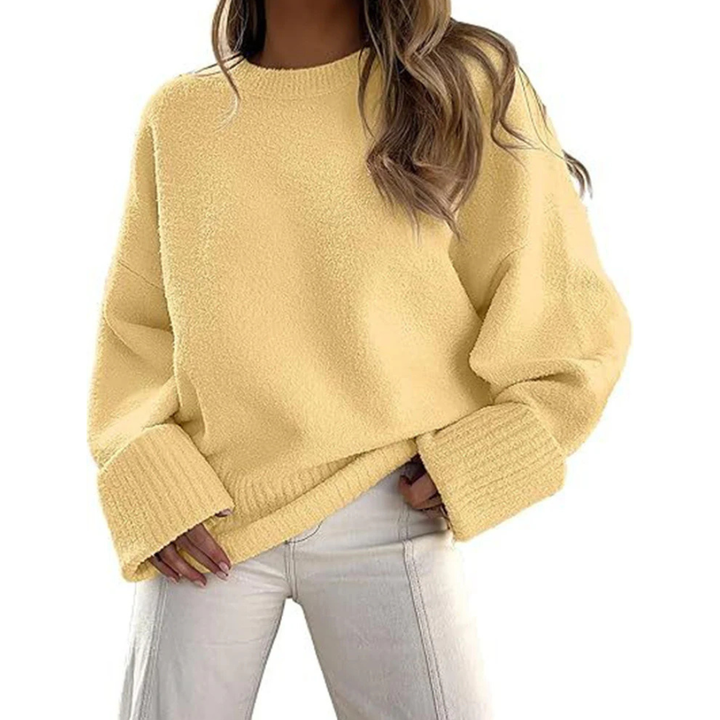 Yellow fuzzy knit pullover sweater with crew neck and ribbed cuffs, oversized fit