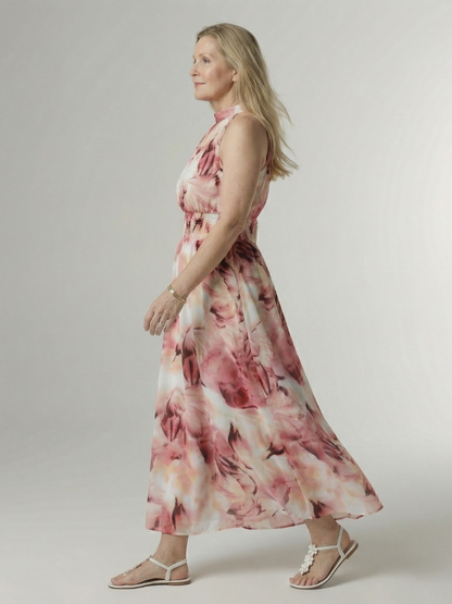 Gathered halter midi dress in pink abstract print with smocked waist, side view