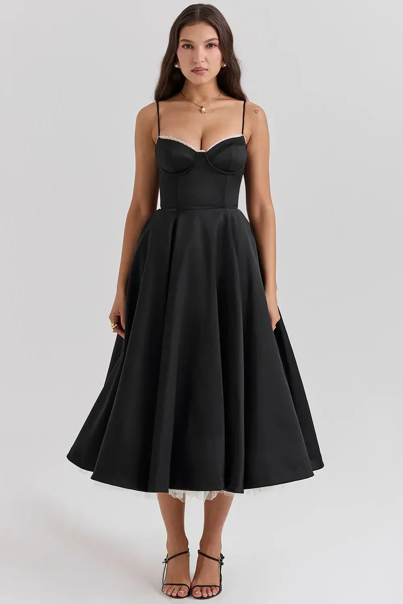 Black satin midi dress with sweetheart bodice, spaghetti straps, and full flared skirt