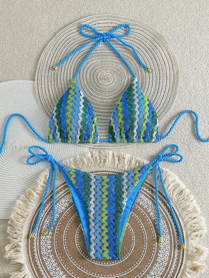 Blue crochet-look triangle bikini with zigzag knit pattern and tie sides