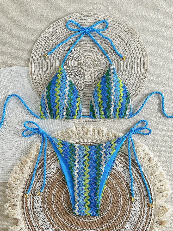 Blue crochet-look triangle bikini with zigzag knit pattern and tie sides