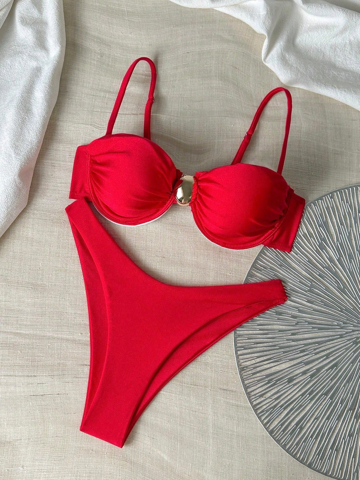 Red high-leg bikini with underwire cups, high-cut bottoms, and adjustable straps