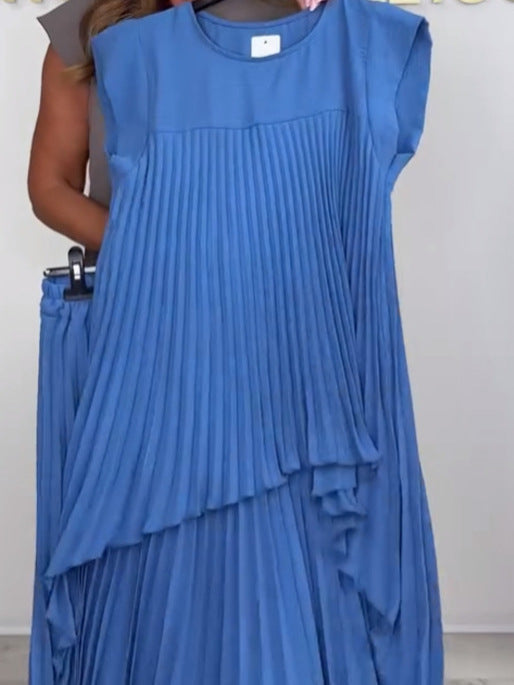 Blue pleated sleeveless top with tiered ruffle front, matching wide-leg pants