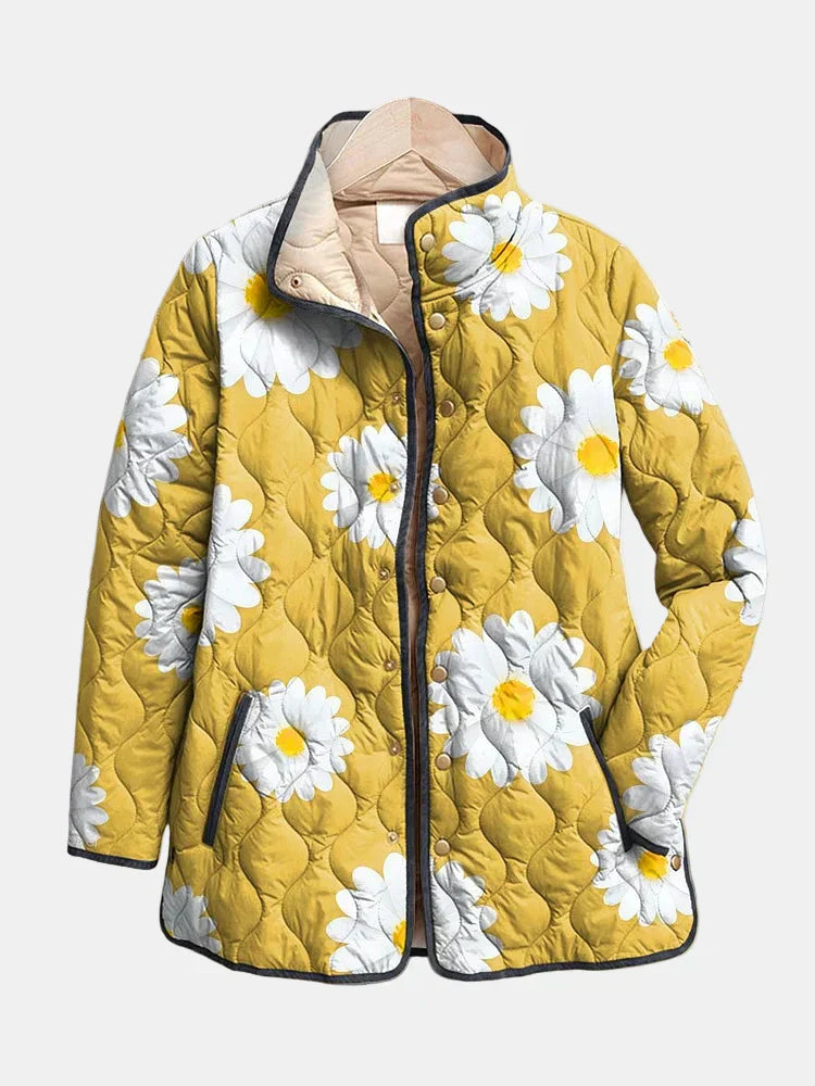 Yellow quilted jacket with white daisy print, button front, stand collar, black trim