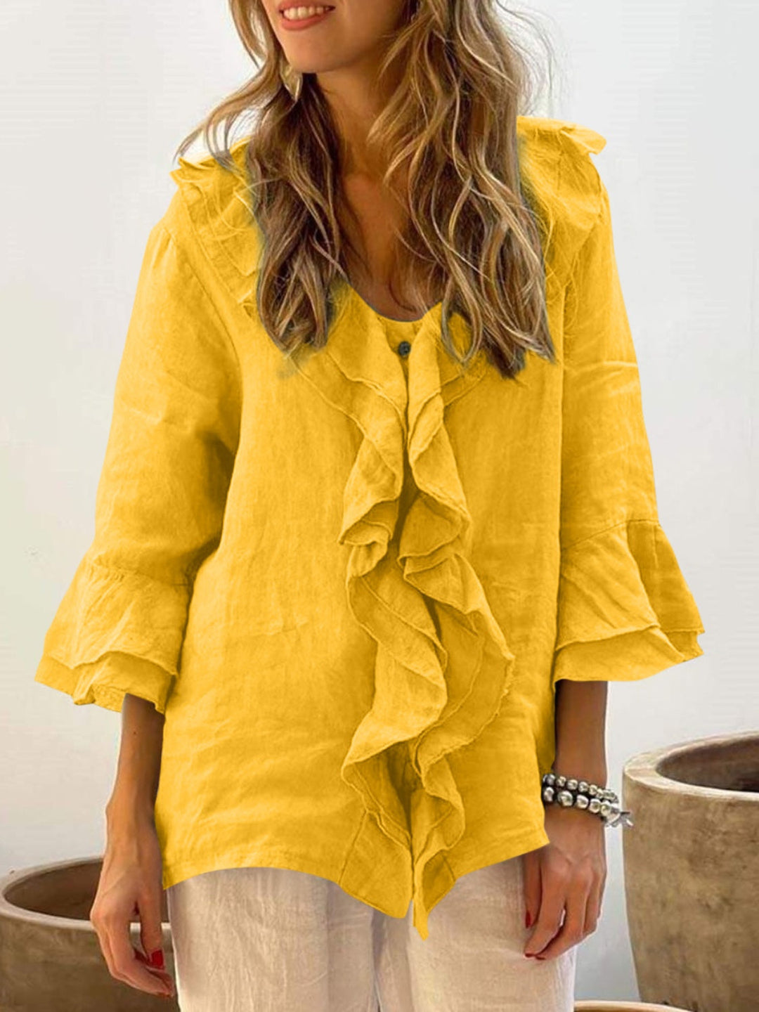 Women’s yellow ruffle bell-sleeve top with button placket and layered front