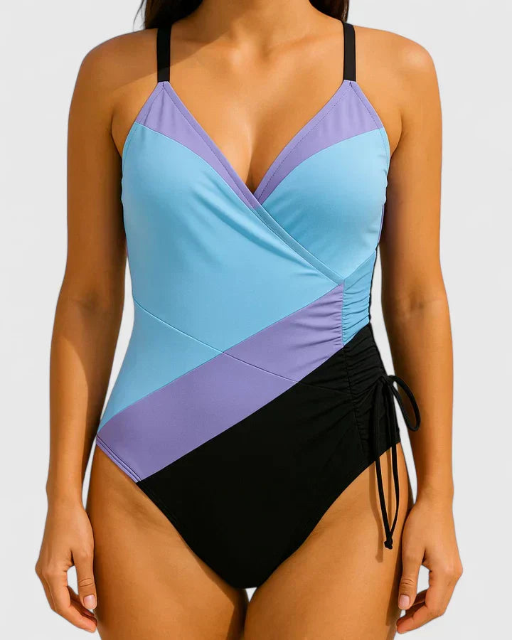 Light blue and purple color-block one-piece swimsuit with V-neck wrap front and side ties