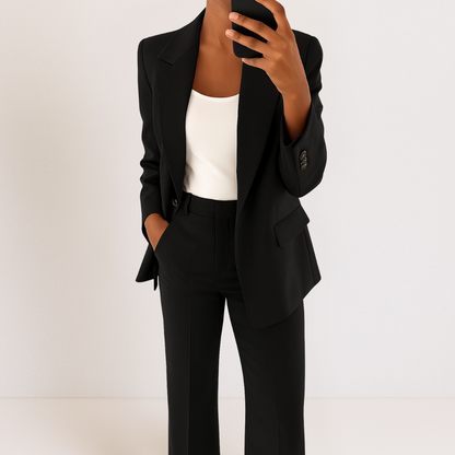 Black two-piece suit set with tailored blazer and matching trousers, notched lapel and flap pockets.