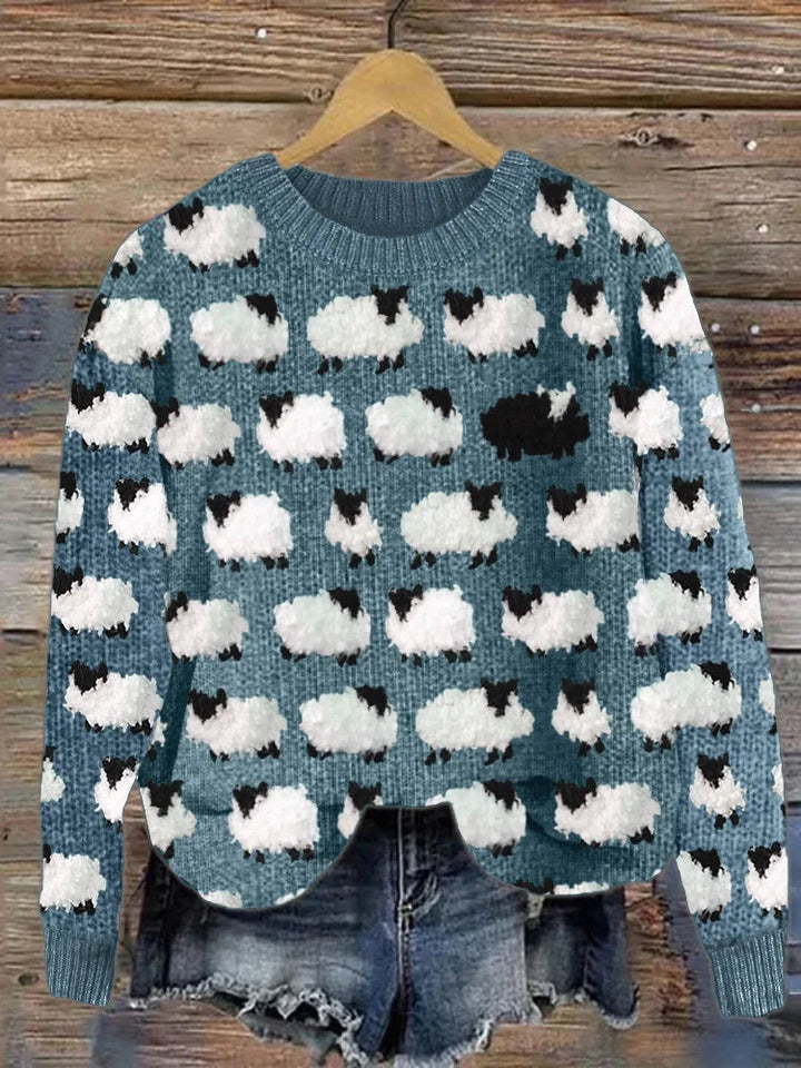 Novelty knit sweater in blue with white and black sheep pattern
