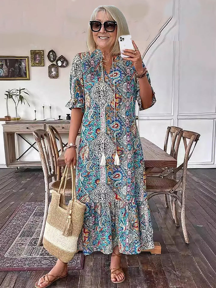 Boho grace dress, teal and blue paisley print, tassel neckline, short sleeves, tiered hem