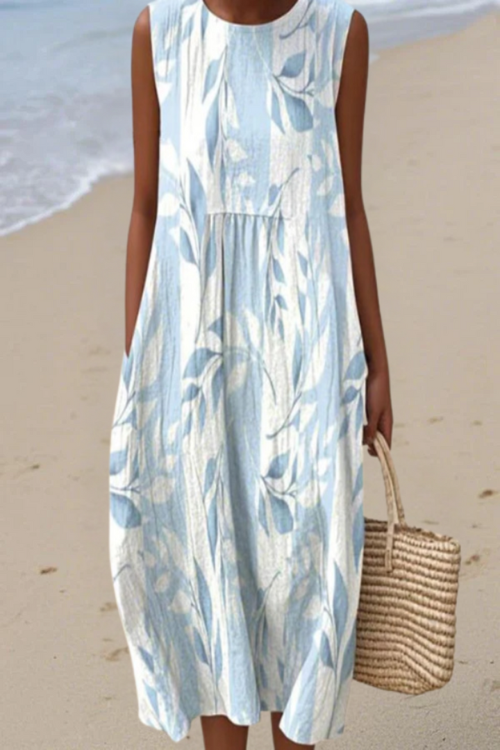 Sleeveless midi dress with light blue leafy print, gathered skirt and round neckline