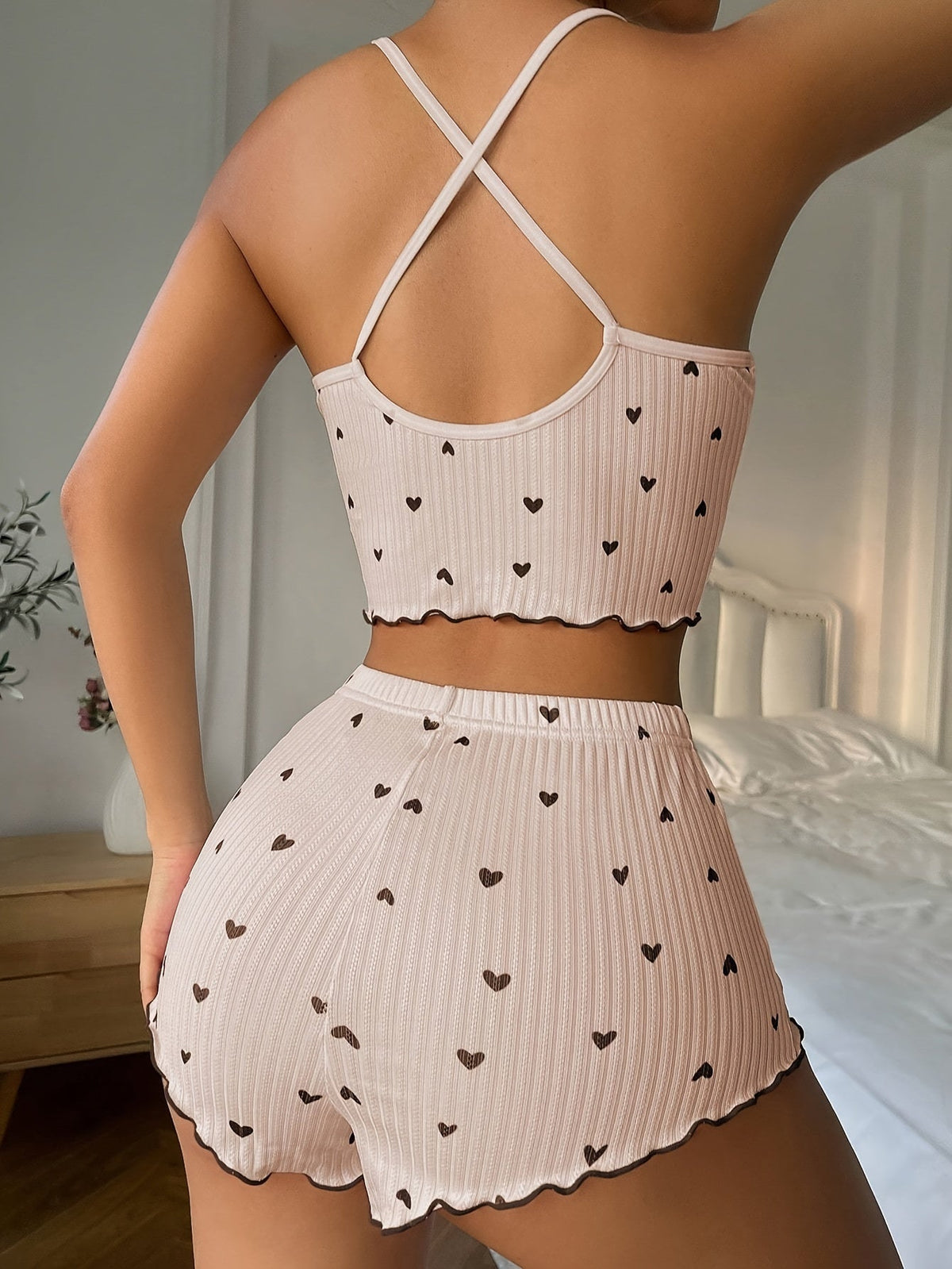 Light beige heart-print pajama set with ruffle trim, crisscross back straps and matching shorts
