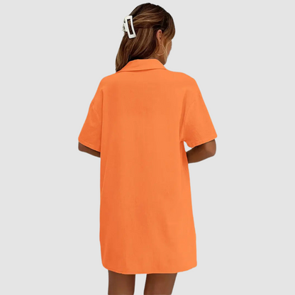 Back view orange short-sleeve button-up top and drawstring shorts set