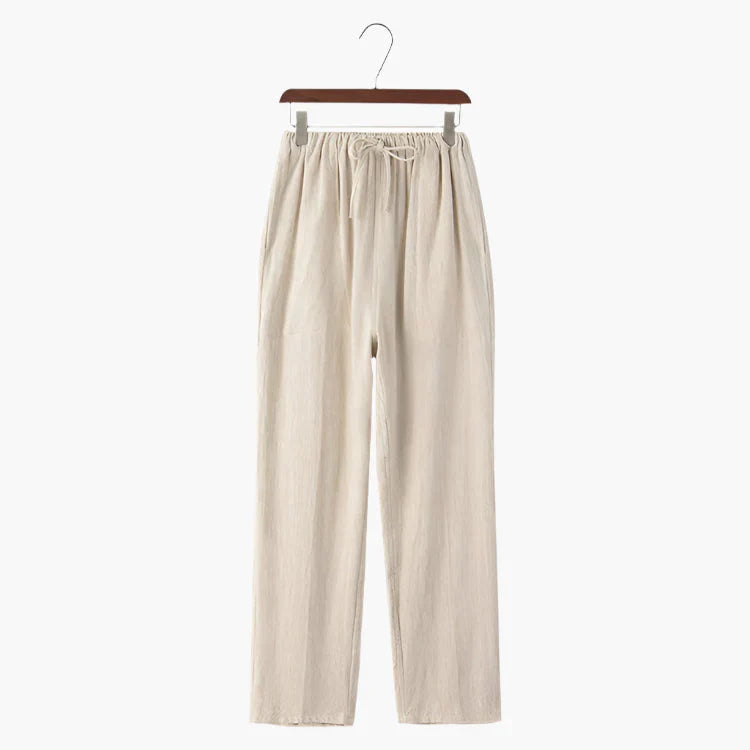 Beige linen pants on hanger, elastic drawstring waist and relaxed straight legs
