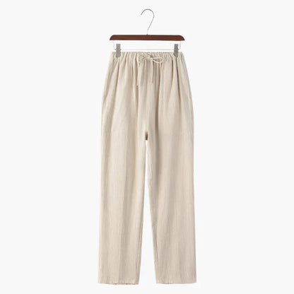 Beige linen pants on hanger, elastic drawstring waist and relaxed straight legs