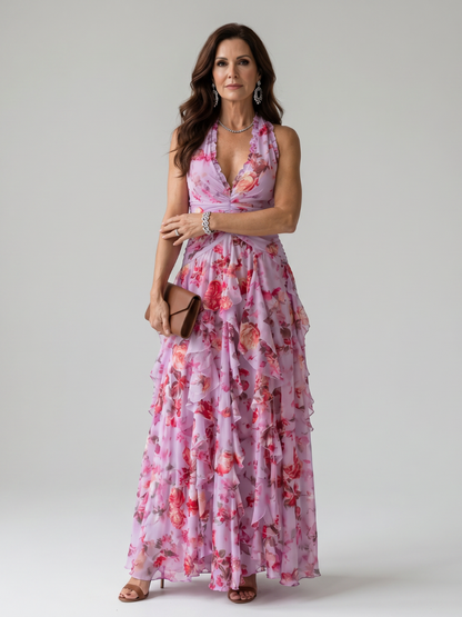 Pink floral maxi dress with halter neck, ruched bodice and layered ruffle skirt