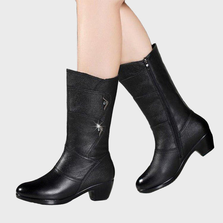 Black zip-up ankle boots with mid block heel and lace-up strap details