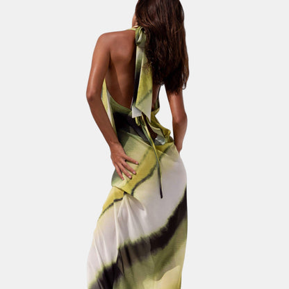Backless watercolor maxi dress with halter neck tie, flowing open-back design