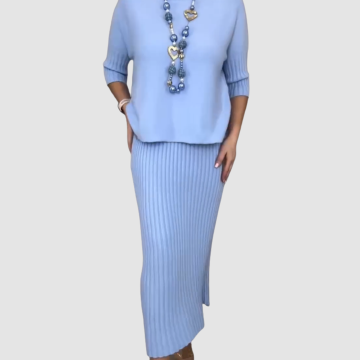 Blue relaxed knit top and ribbed midi skirt set with heart pendant necklace
