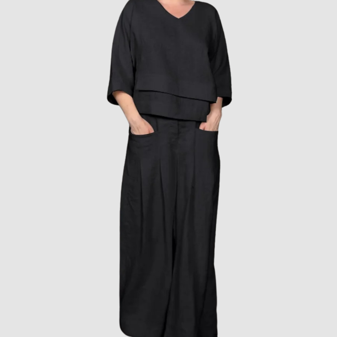 Black relaxed 2-piece set with V-neck top and wide-leg pants, tiered hem