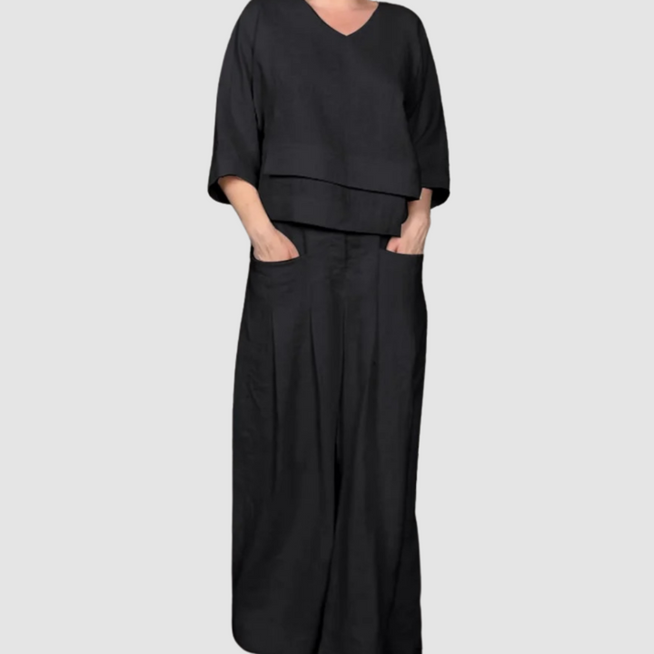 Black relaxed 2-piece set with V-neck top and wide-leg pants, tiered hem