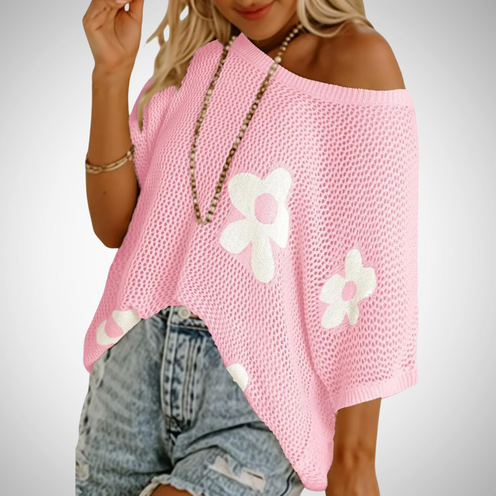 Pink off-shoulder crochet top with flower appliques and wide knit hem