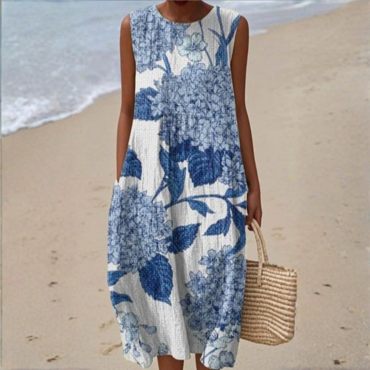 Sleeveless summer dress, blue and white floral block print, round neckline, midi length