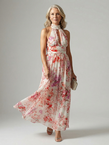 Floral maxi dress with halter neck and gathered waist, sleeveless flowing skirt