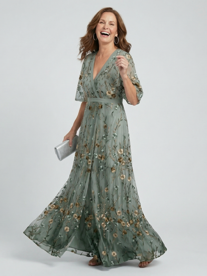 Sage green maxi dress with V-neck, flutter sleeves, floral print, tie waist