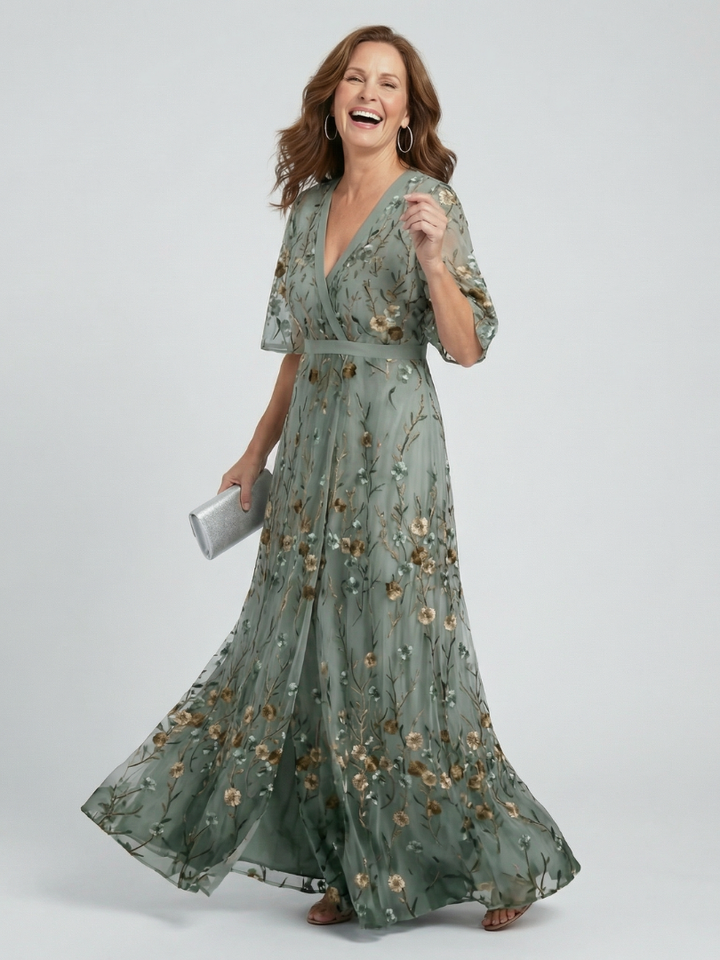 Sage green maxi dress with V-neck, flutter sleeves, floral print, tie waist