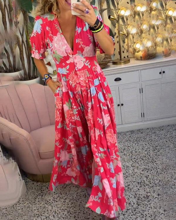 Floral maxi dress in red with pastel floral print, V-neck bodice and tiered skirt