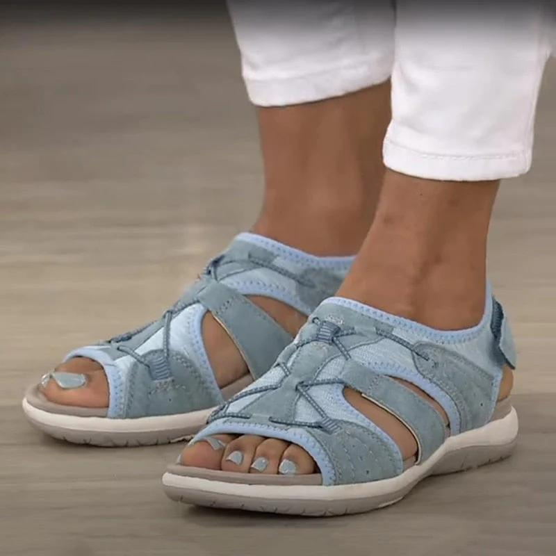 Light blue orthopaedic sandals with hook-and-loop strap and padded footbed