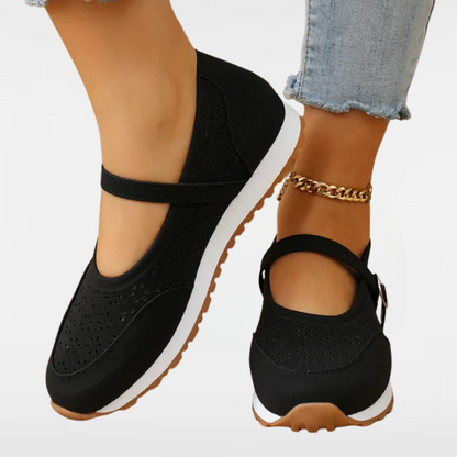 Women's black perforated Mary Jane sneakers with soft rubber sole and ankle strap