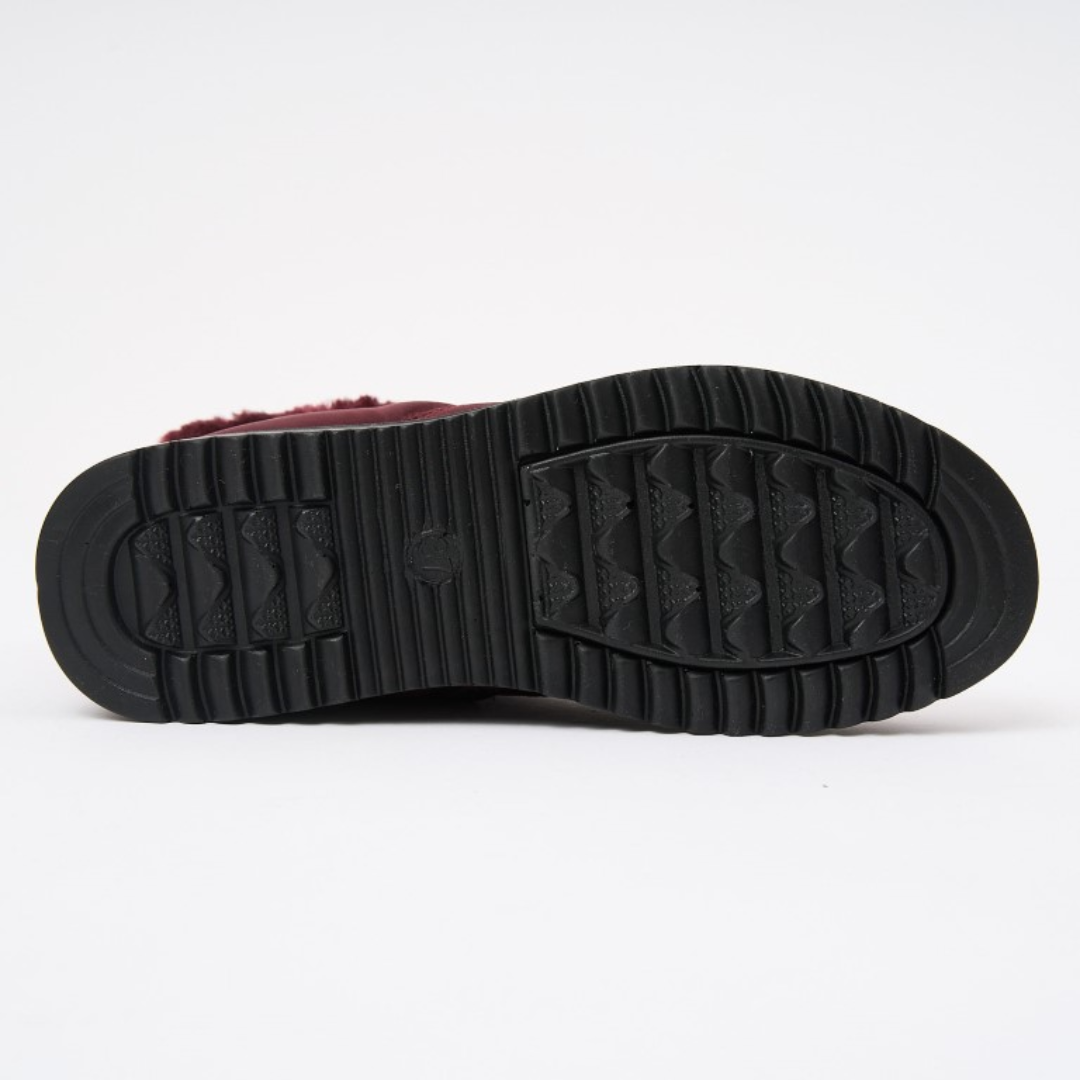 Black rubber outsole tread with deep grooves for traction