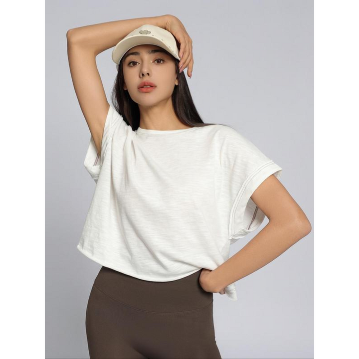 White women’s cut out hemline short-sleeve top, crew neck, relaxed drape