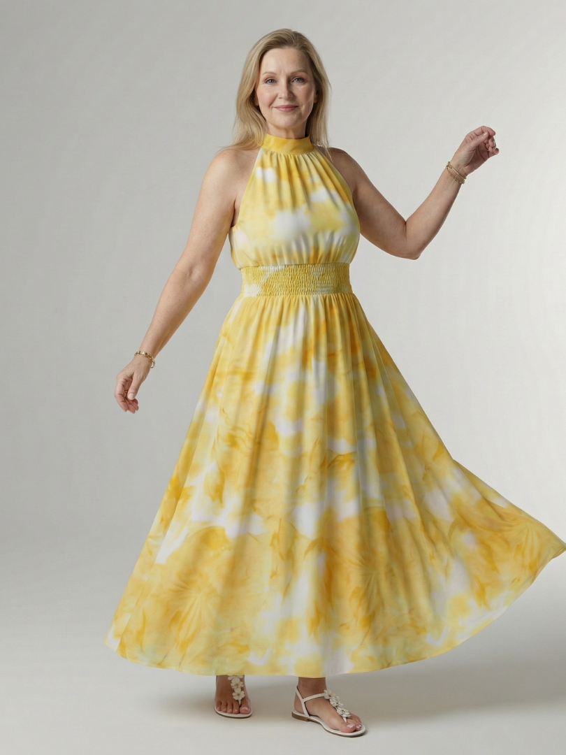 Yellow gathered halter midi dress with smocked waist and flowy skirt