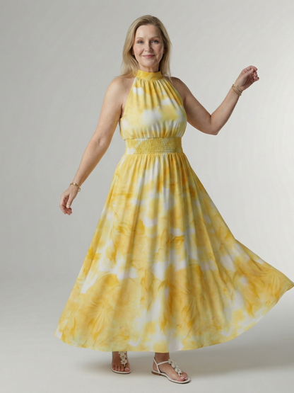 Yellow gathered halter midi dress with smocked waist and flowy skirt