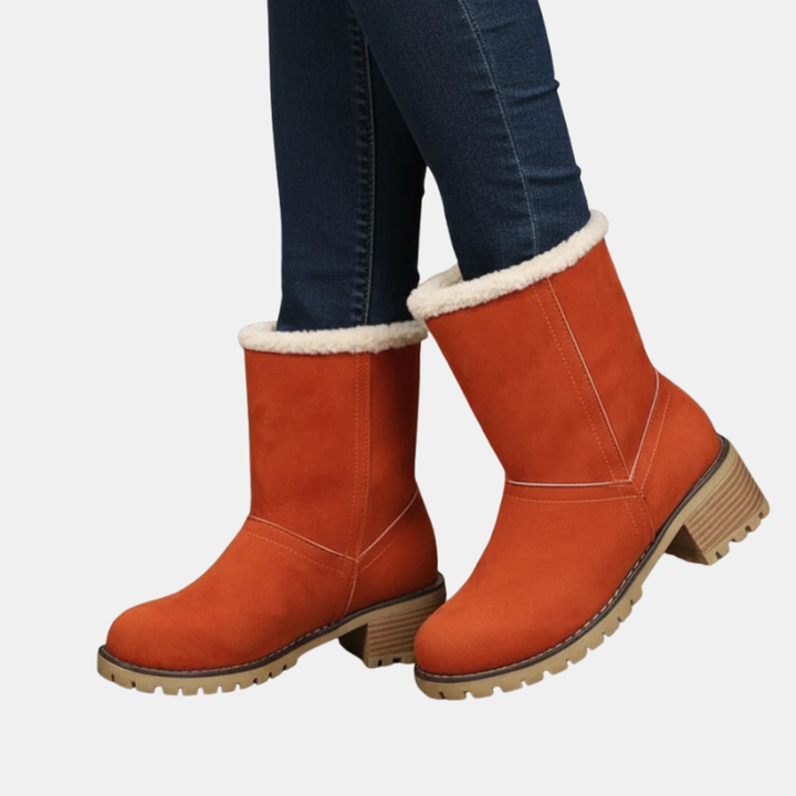 Ankle boots in orange with cream faux-fur cuff and block heel, lug sole