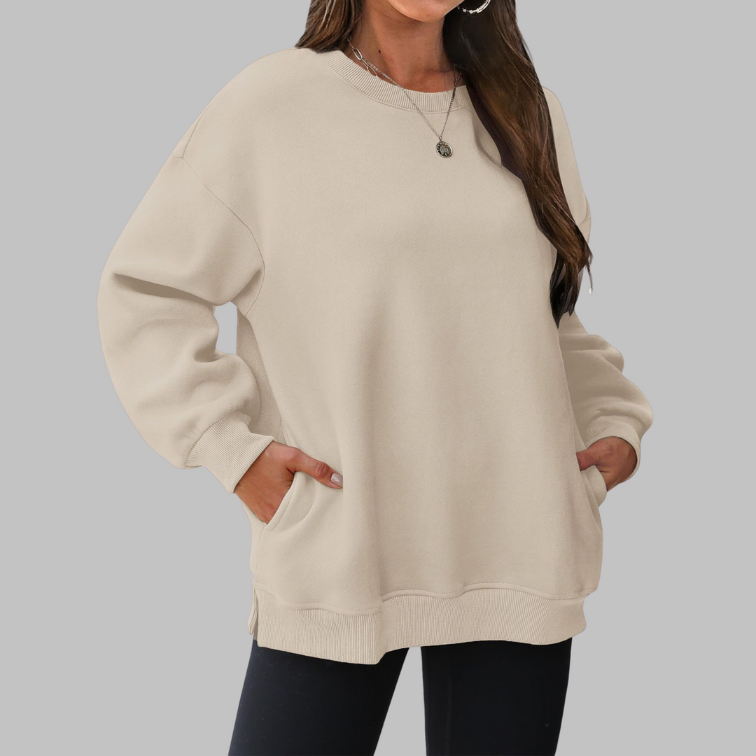 Light beige oversized crewneck long sleeve sweater with ribbed cuffs and hem