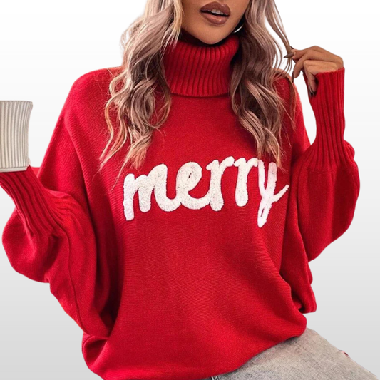 Red knit turtleneck sweater with batwing sleeves and white “Merry” print