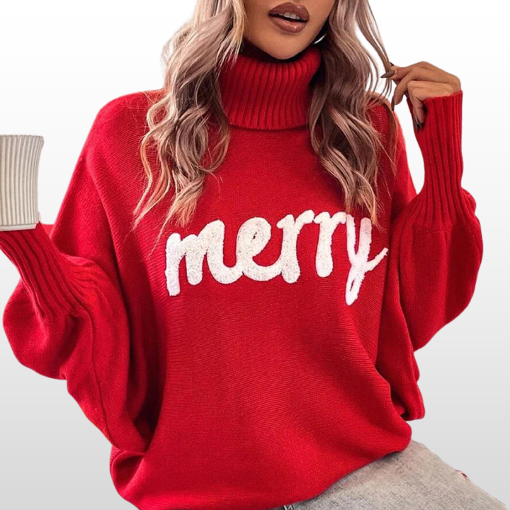 Red knit turtleneck sweater with batwing sleeves and white “Merry” print
