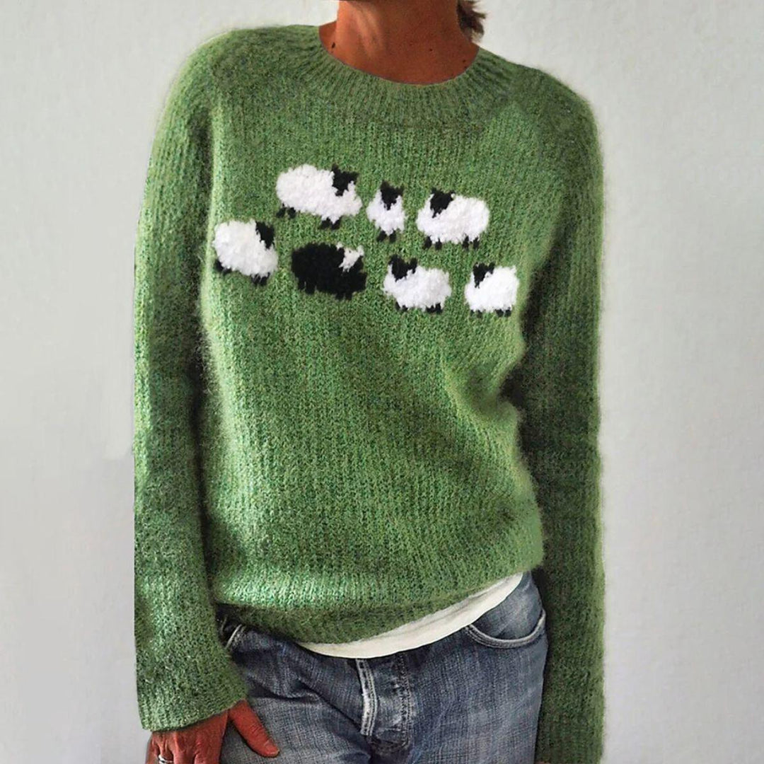 Green knit crewneck sweater with long sleeves and black/white animal graphic on chest