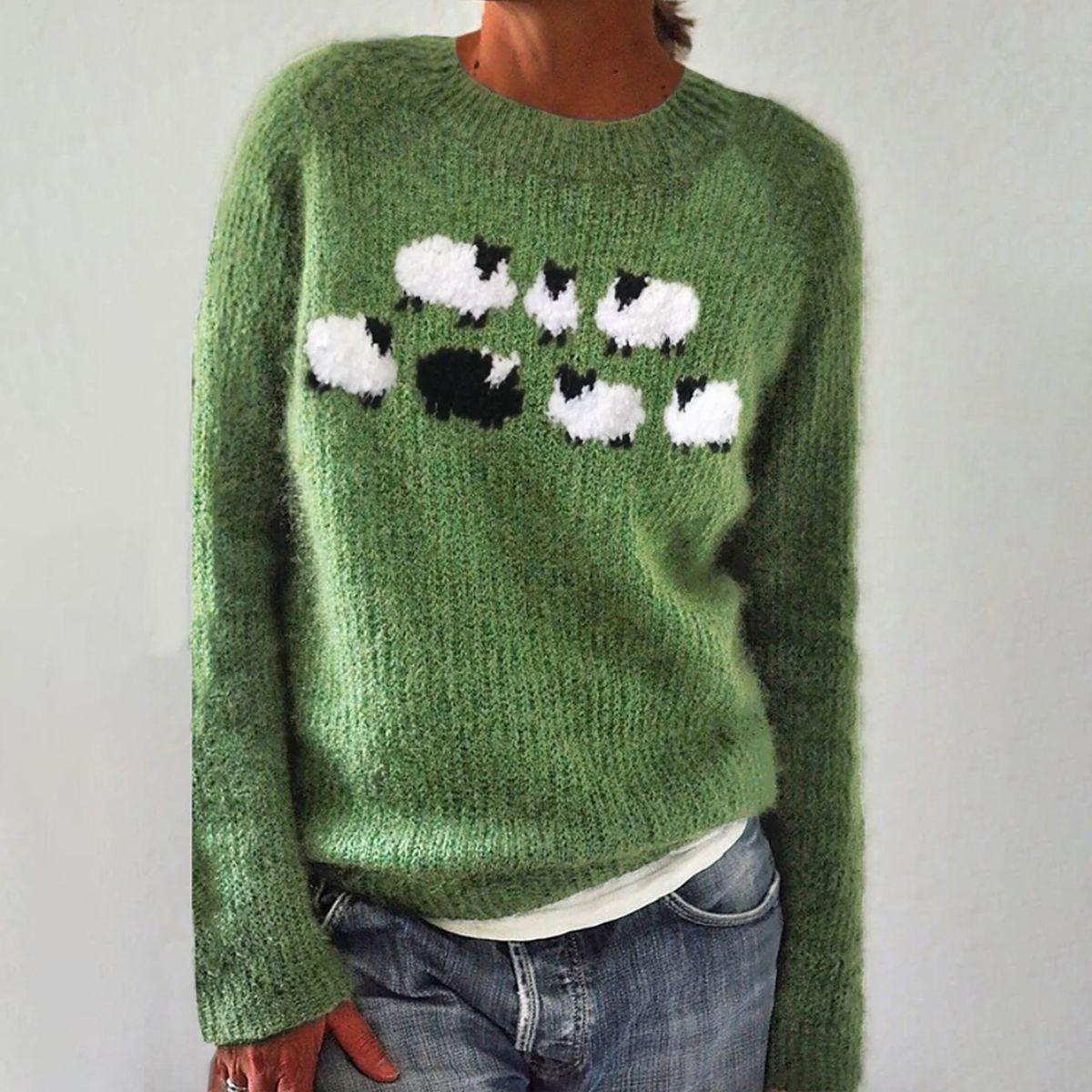 Green knit crewneck sweater with long sleeves and black/white animal graphic on chest