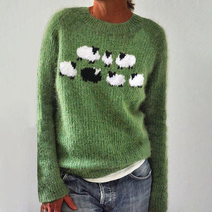 Green knit crewneck sweater with long sleeves and black/white animal graphic on chest